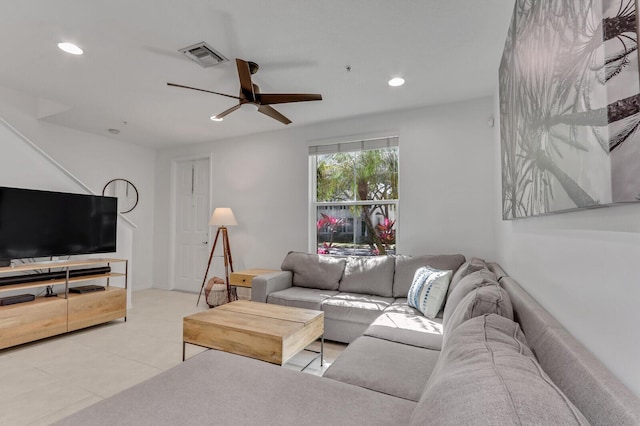 tiled living room with ceiling fan