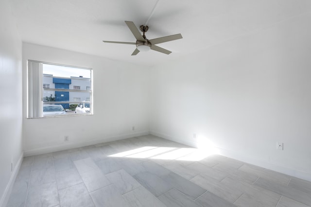 unfurnished room with ceiling fan