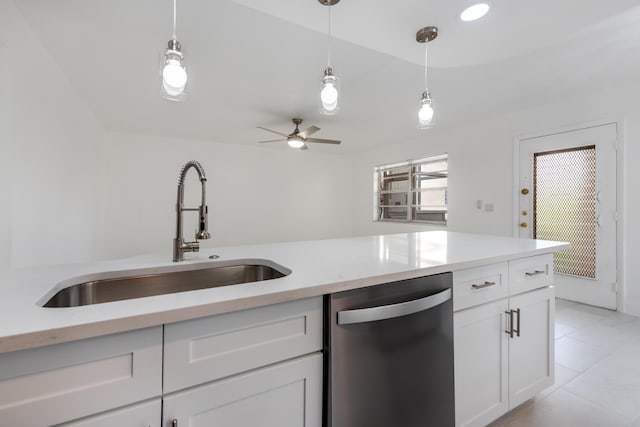 kitchen with white cabinetry, sink, hanging light fixtures, and dishwasher