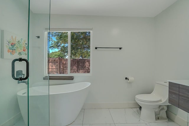 bathroom featuring vanity, toilet, and a bathing tub