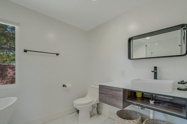 bathroom featuring vanity, toilet, and walk in shower