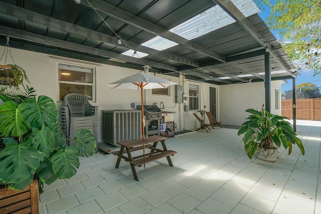 view of patio / terrace with area for grilling and a pergola