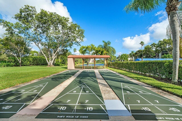 surrounding community with a gazebo and a yard