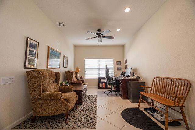 tiled office with ceiling fan