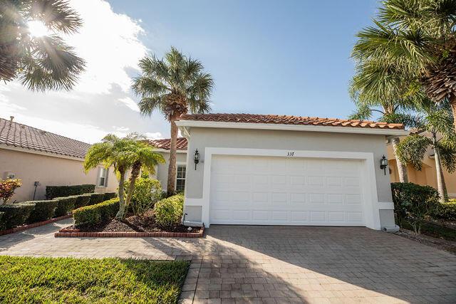 mediterranean / spanish-style home featuring a garage