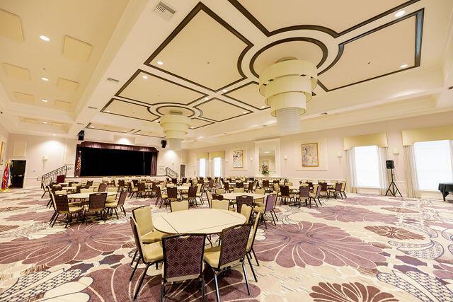 dining room with coffered ceiling and ornate columns