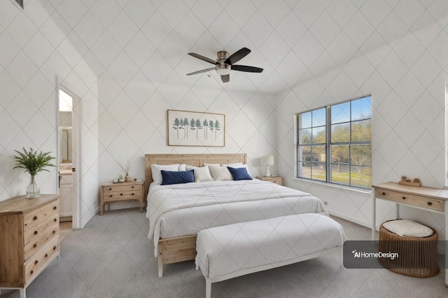 bedroom with a ceiling fan and ensuite bath