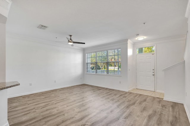 entrance foyer with crown molding, light hardwood / wood-style floors, and ceiling fan