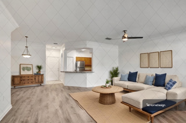 living area with ceiling fan