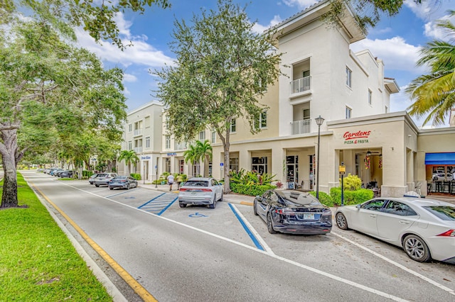 view of property featuring uncovered parking