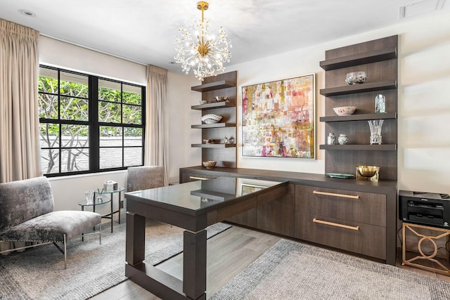 office with a notable chandelier and light hardwood / wood-style floors