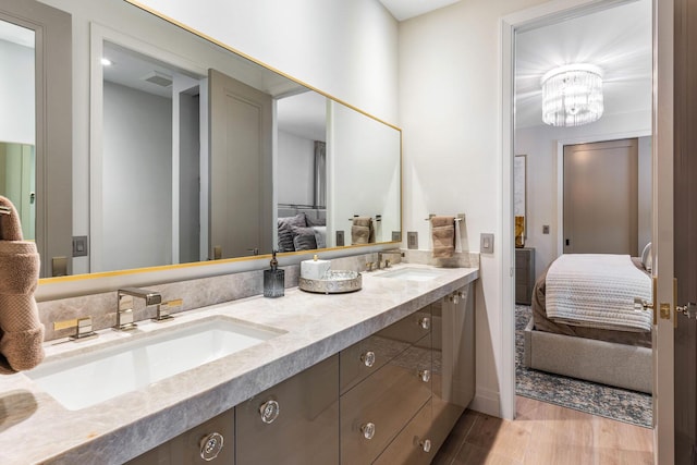 bathroom featuring vanity and hardwood / wood-style flooring