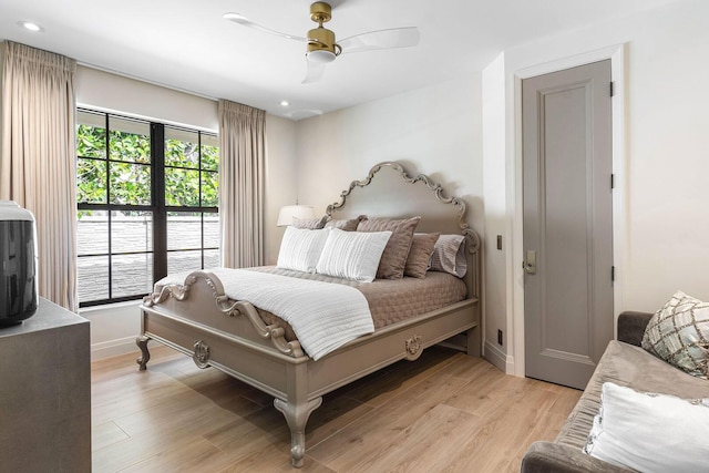 bedroom featuring ceiling fan and light wood-type flooring