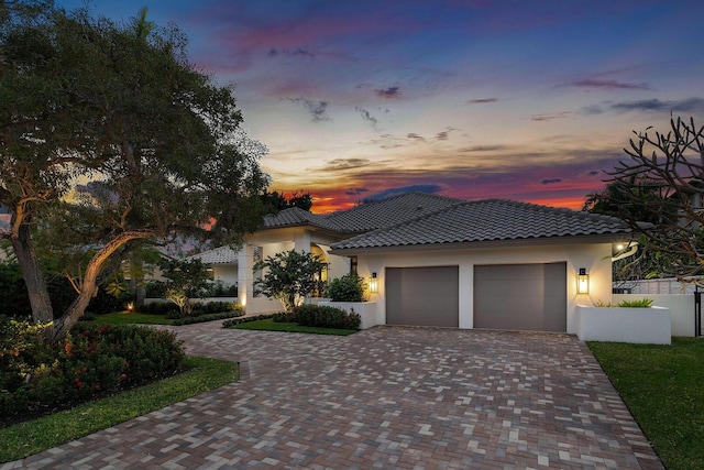 mediterranean / spanish-style house featuring a garage