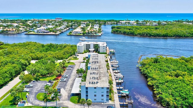 birds eye view of property featuring a water view