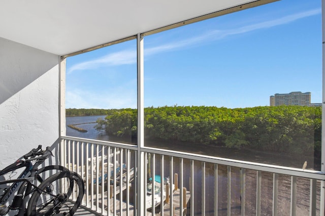 balcony featuring a water view