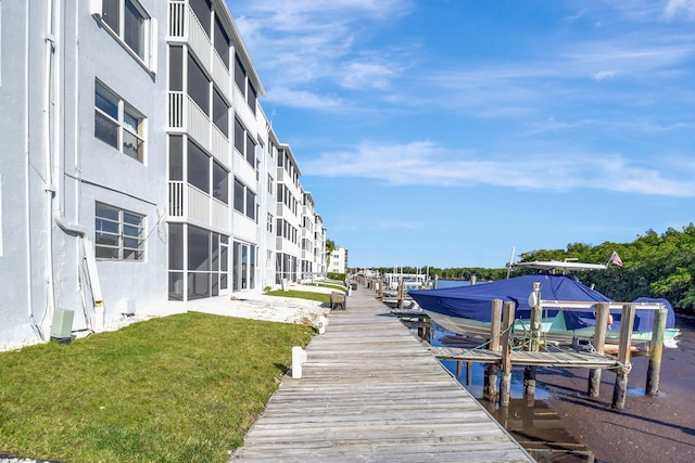 view of dock featuring a yard