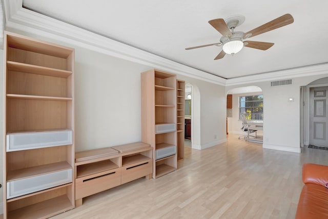 unfurnished living room with crown molding, ceiling fan, and light hardwood / wood-style floors