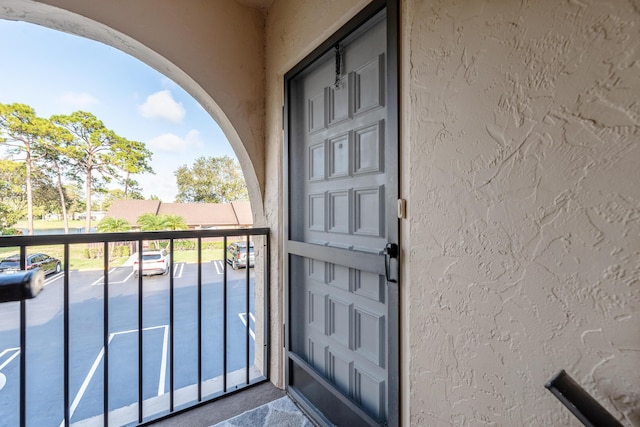 doorway to property with a balcony