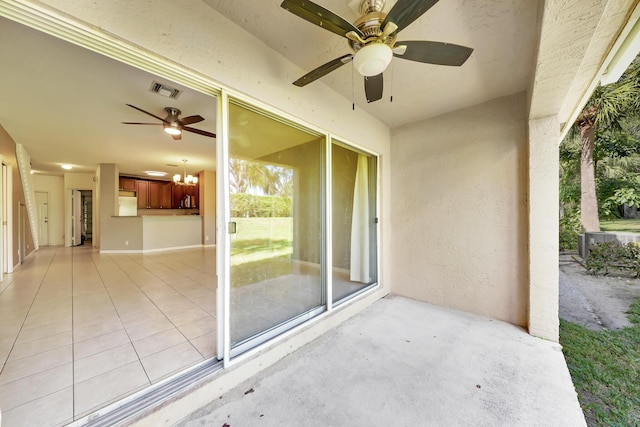 view of patio featuring ceiling fan