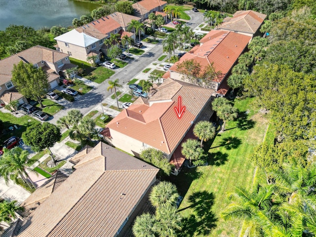 birds eye view of property featuring a water view