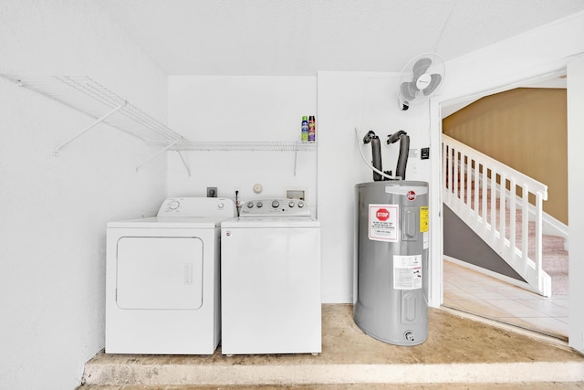 washroom featuring washer and clothes dryer and water heater