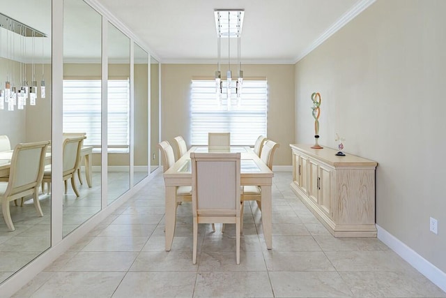 dining room with a notable chandelier, light tile patterned floors, baseboards, and ornamental molding