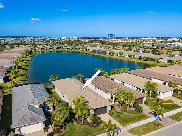 bird's eye view with a residential view and a water view