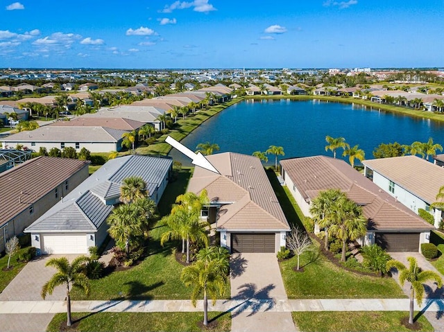 aerial view featuring a residential view and a water view