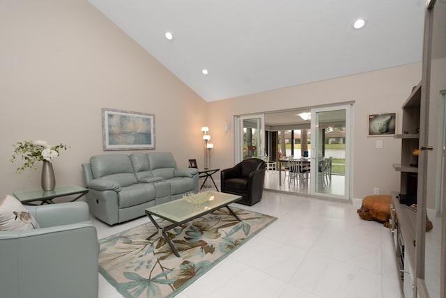 living room with high vaulted ceiling and recessed lighting