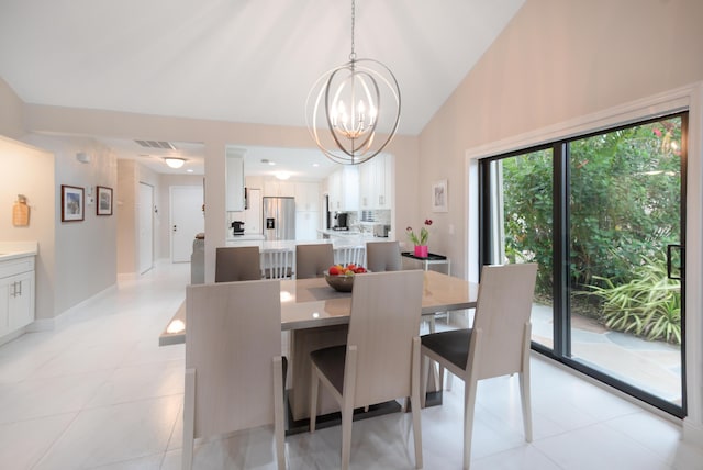 dining area with high vaulted ceiling, light tile patterned floors, visible vents, a chandelier, and baseboards