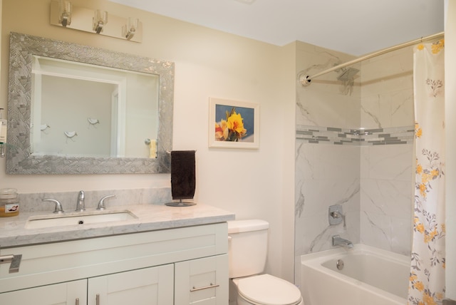 bathroom featuring toilet, shower / bath combo with shower curtain, and vanity