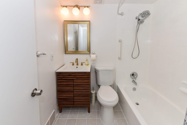 full bathroom featuring vanity, tile patterned flooring, tiled shower / bath combo, and toilet