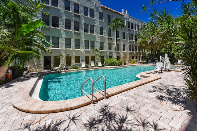 view of swimming pool featuring a patio area