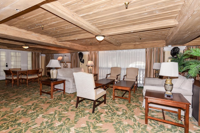 living room with wood ceiling, beamed ceiling, and carpet