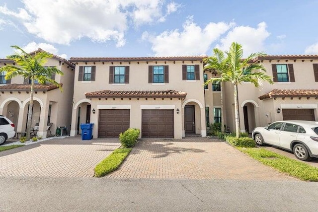 mediterranean / spanish-style home featuring a garage