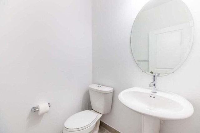 bathroom featuring sink and toilet