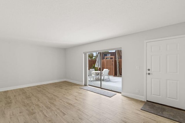 unfurnished room featuring light hardwood / wood-style floors