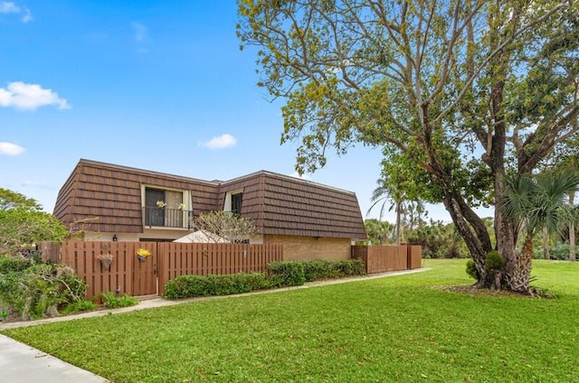 view of property exterior featuring a lawn