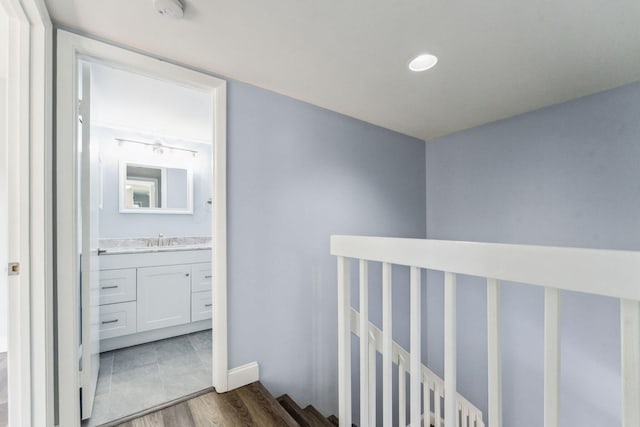 hall featuring sink and dark hardwood / wood-style flooring