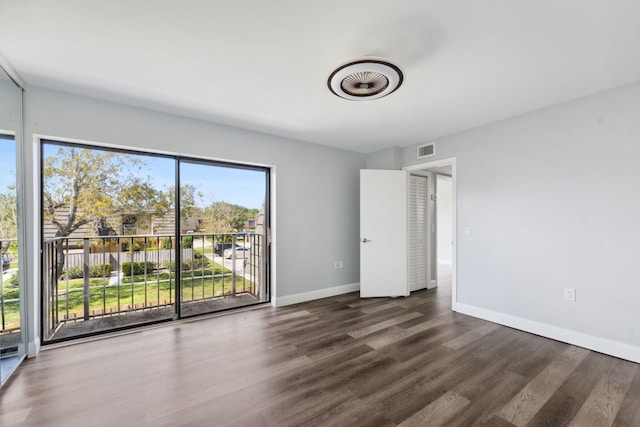 unfurnished bedroom featuring dark hardwood / wood-style flooring