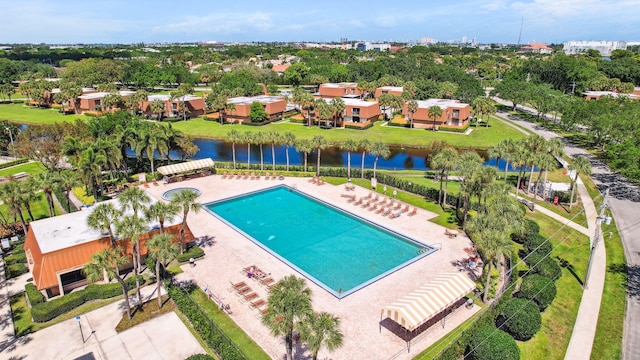 view of pool with a water view