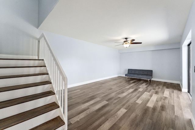 interior space featuring wood-type flooring and ceiling fan