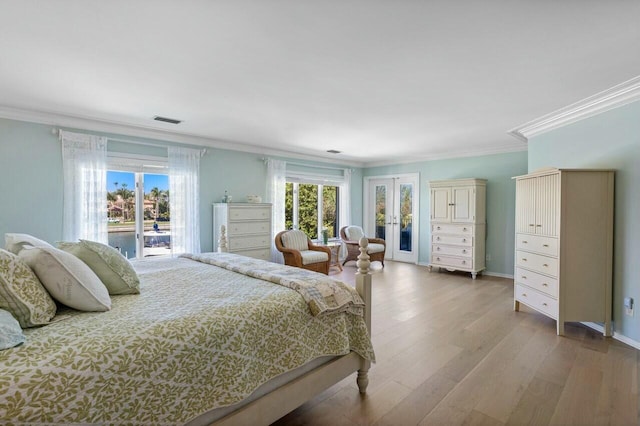 bedroom with french doors, access to exterior, hardwood / wood-style floors, and ornamental molding