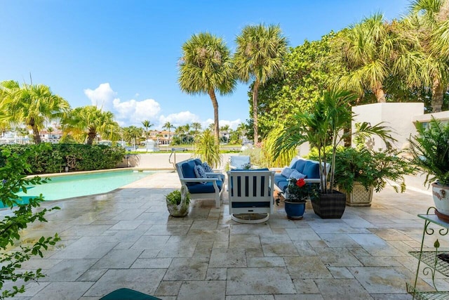 view of patio / terrace with a fenced in pool