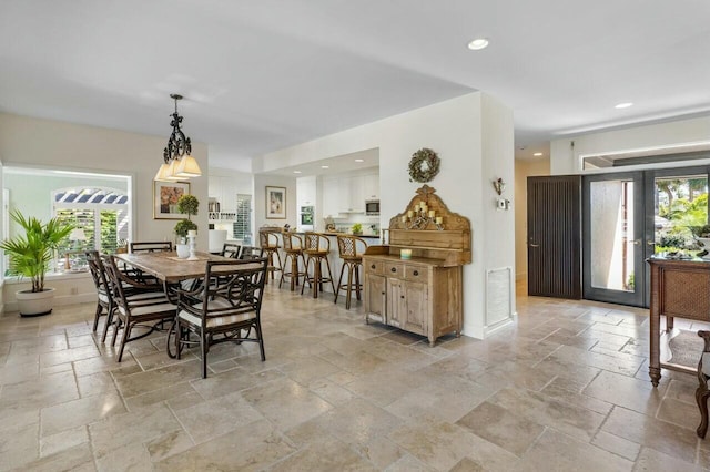 dining space featuring french doors