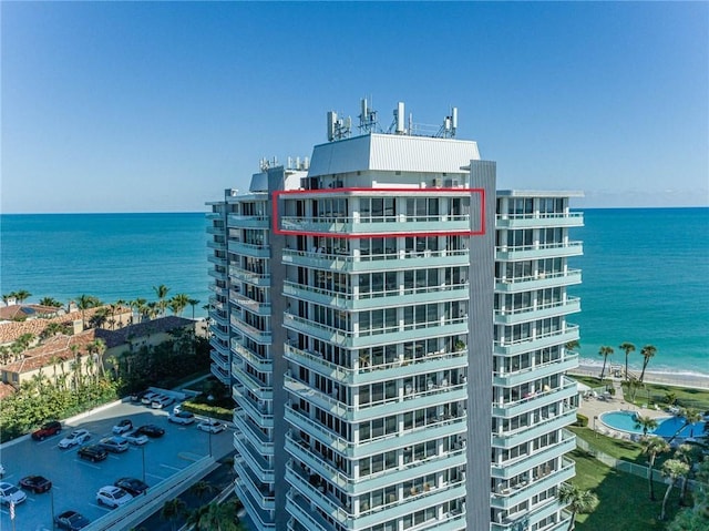 view of building exterior with a water view