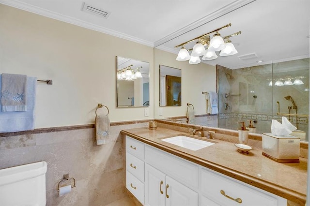 bathroom with toilet, a shower with shower door, tile walls, ornamental molding, and vanity