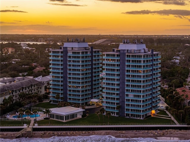 view of outdoor building at dusk