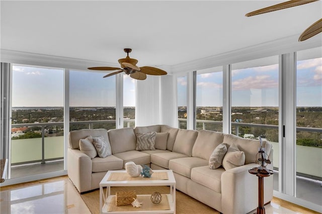 sunroom featuring ceiling fan